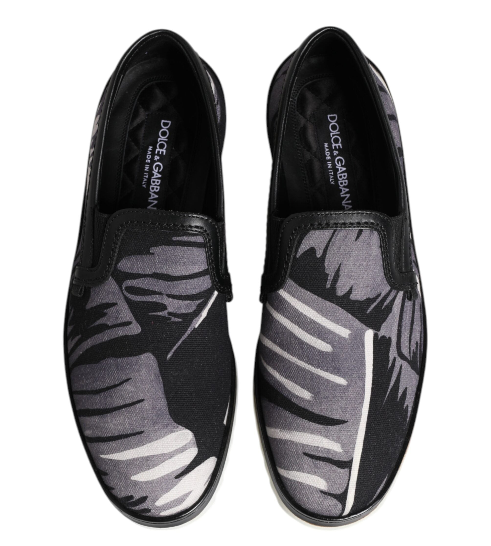 Black loafers with gray pattern on a white background