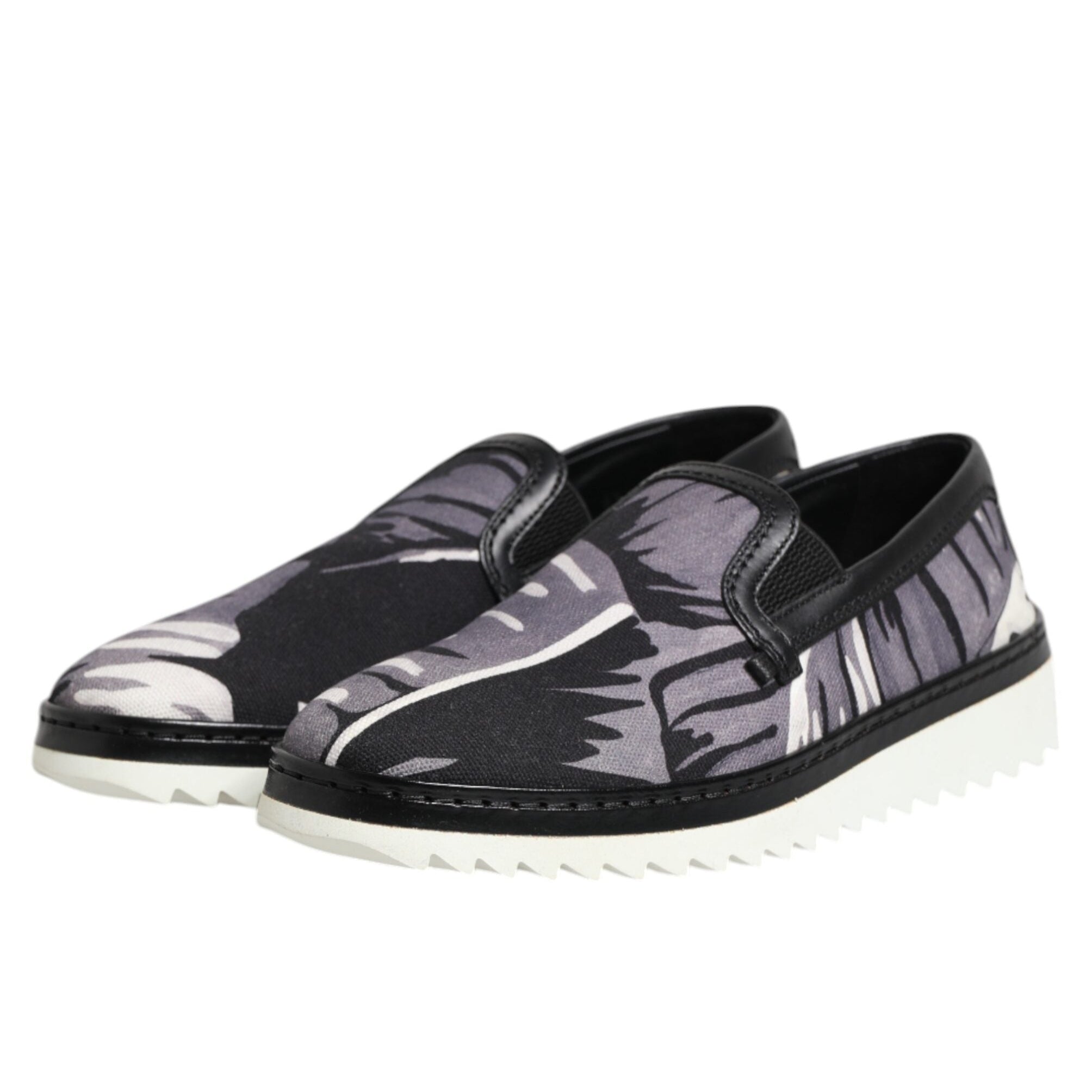 Black and gray patterned slip-on shoes on a white background