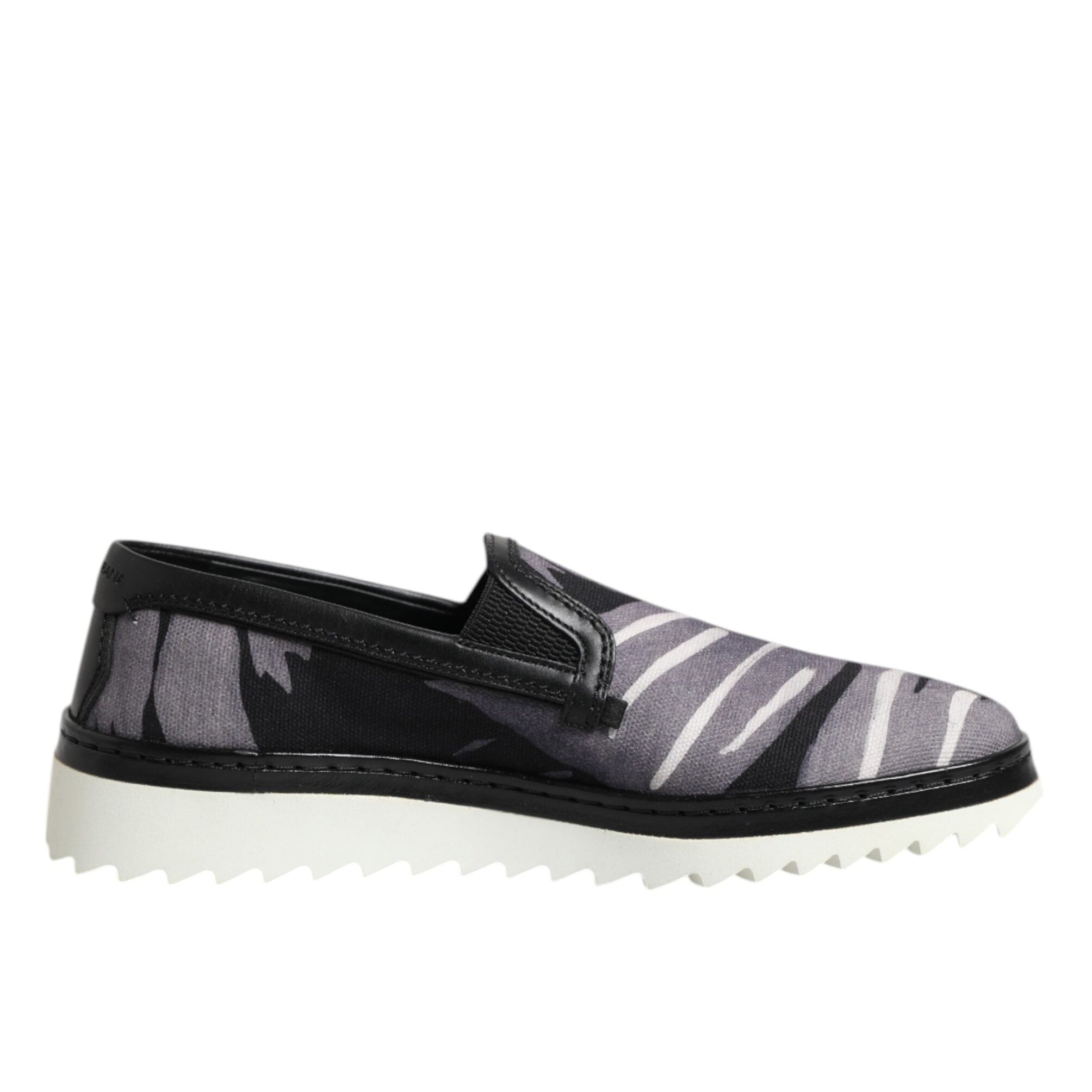Black and gray slip-on shoe with white sole on a white background