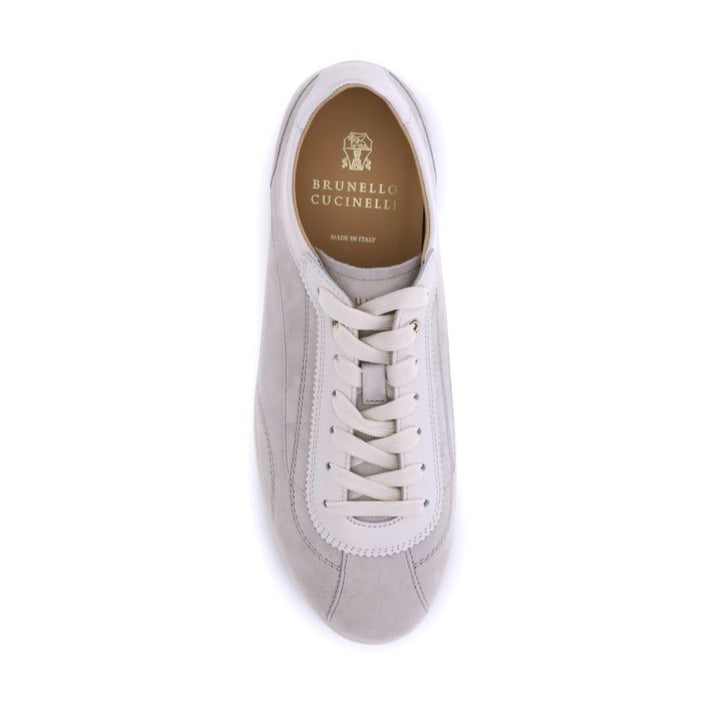 White sneaker with laces on a white background