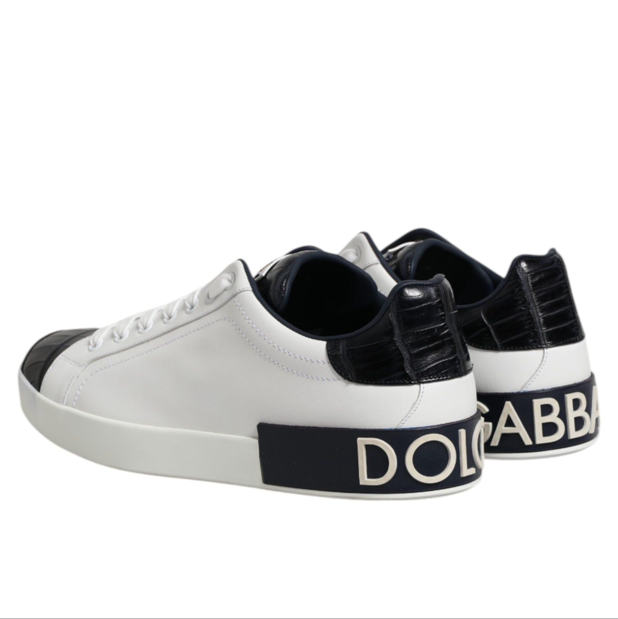 White sneakers with black accents and Dolce & Gabbana branding on a white background