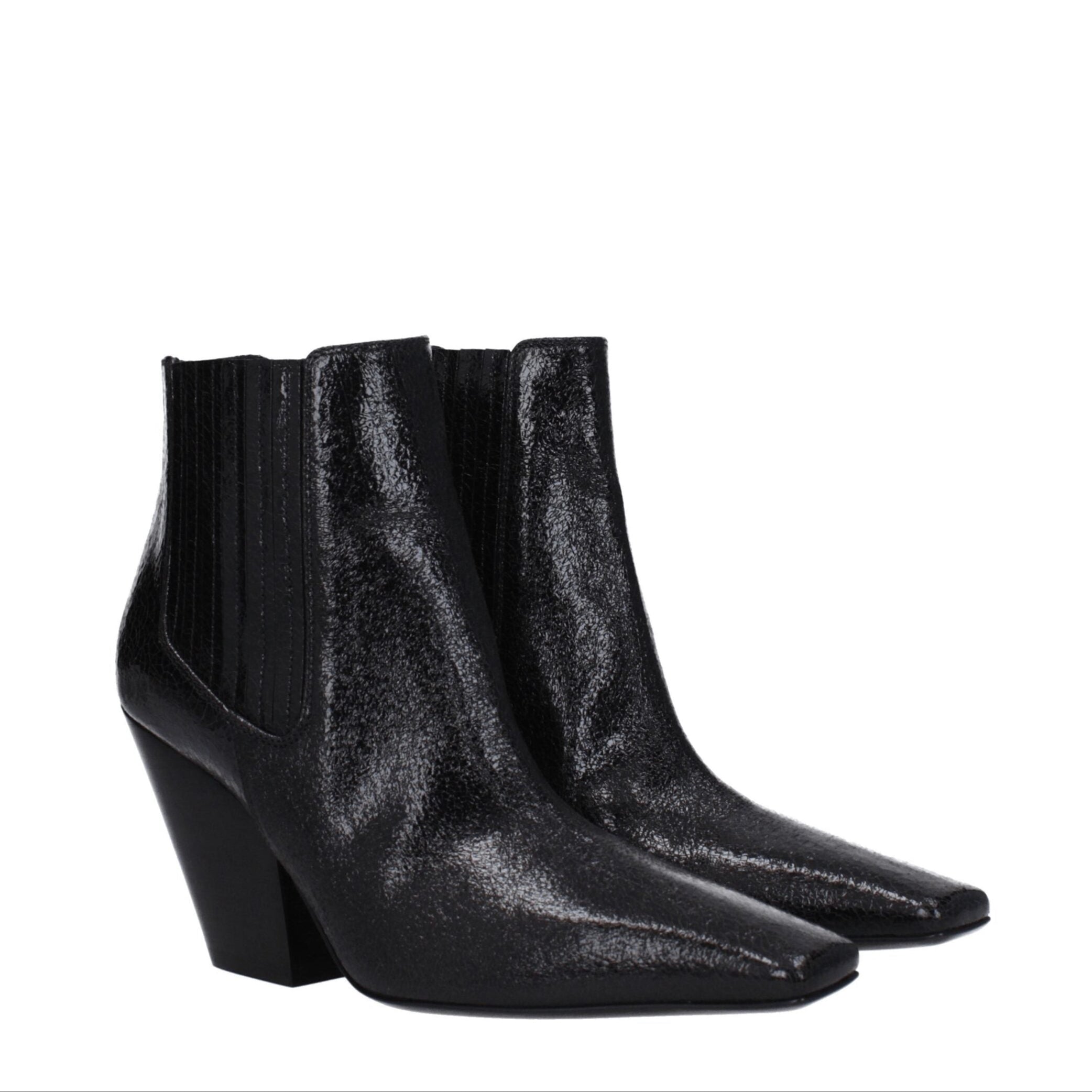 Black shiny ankle boots on a white background