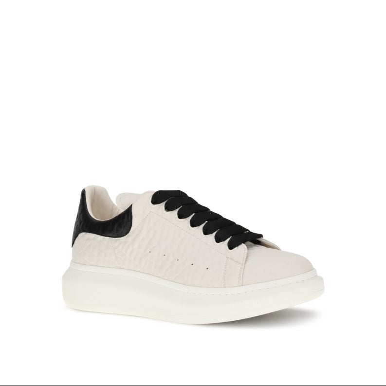 White sneaker with black accents on a white background