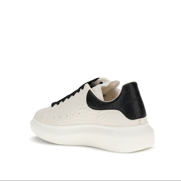 White sneaker with black accents on a white background