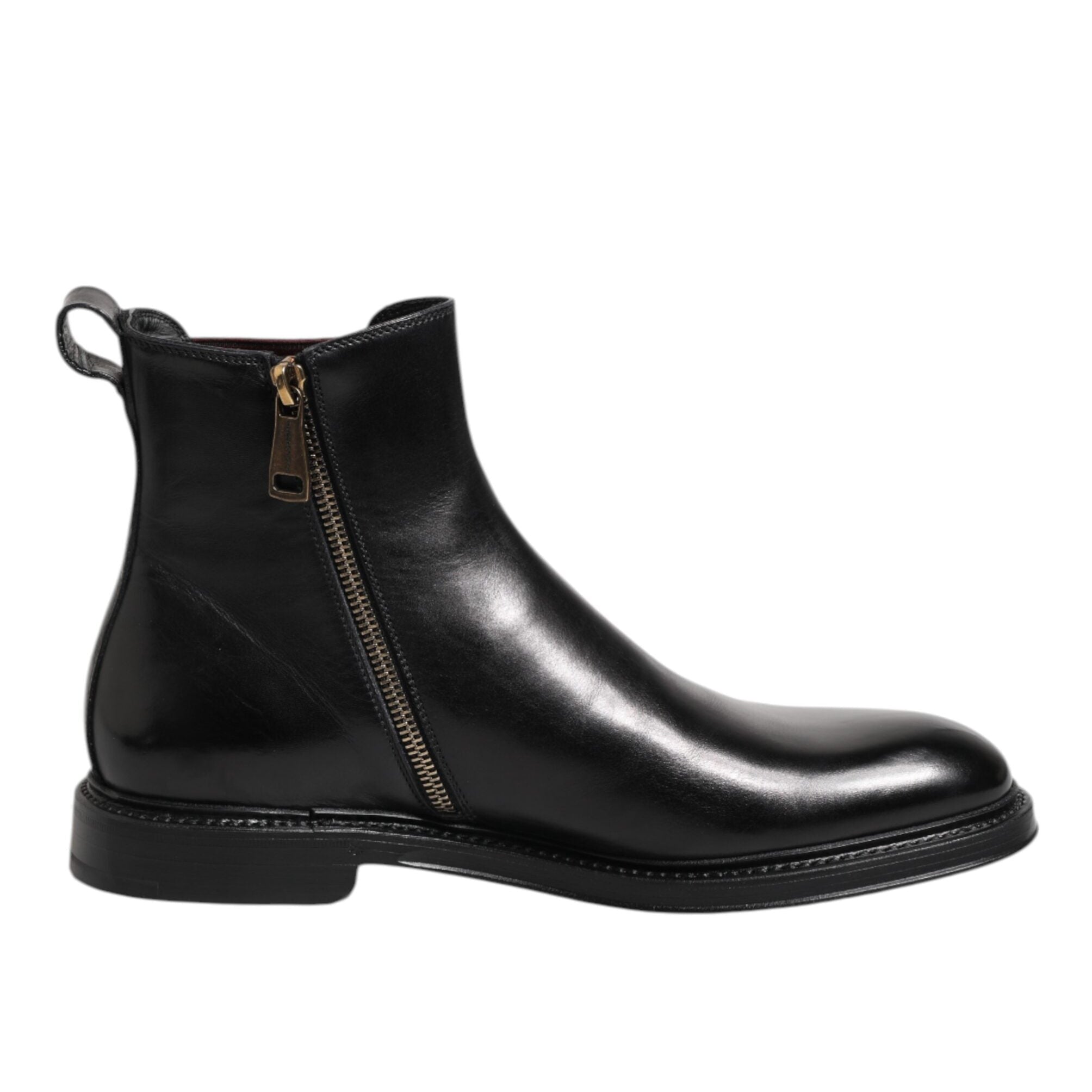 Black leather Chelsea boot with a zipper on a white background