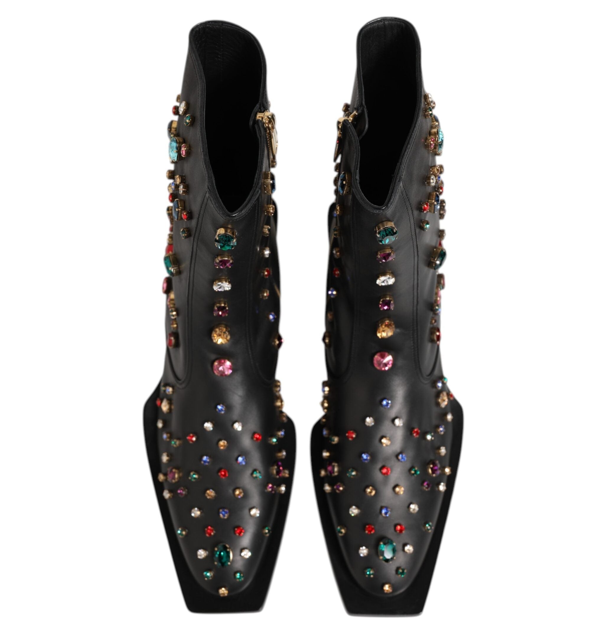 Black studded shoes with colorful gemstones on a white background