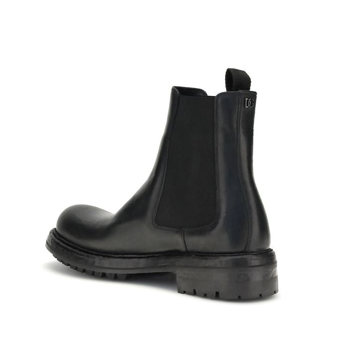 Black Chelsea boot on a white background