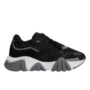 A pair of black leather mesh chunky low-top sneakers with a lace-up closure and white sole.