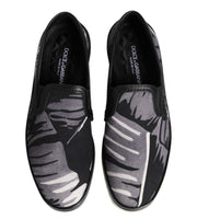 Black loafers with gray pattern on a white background