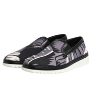Black and gray patterned slip-on shoes on a white background
