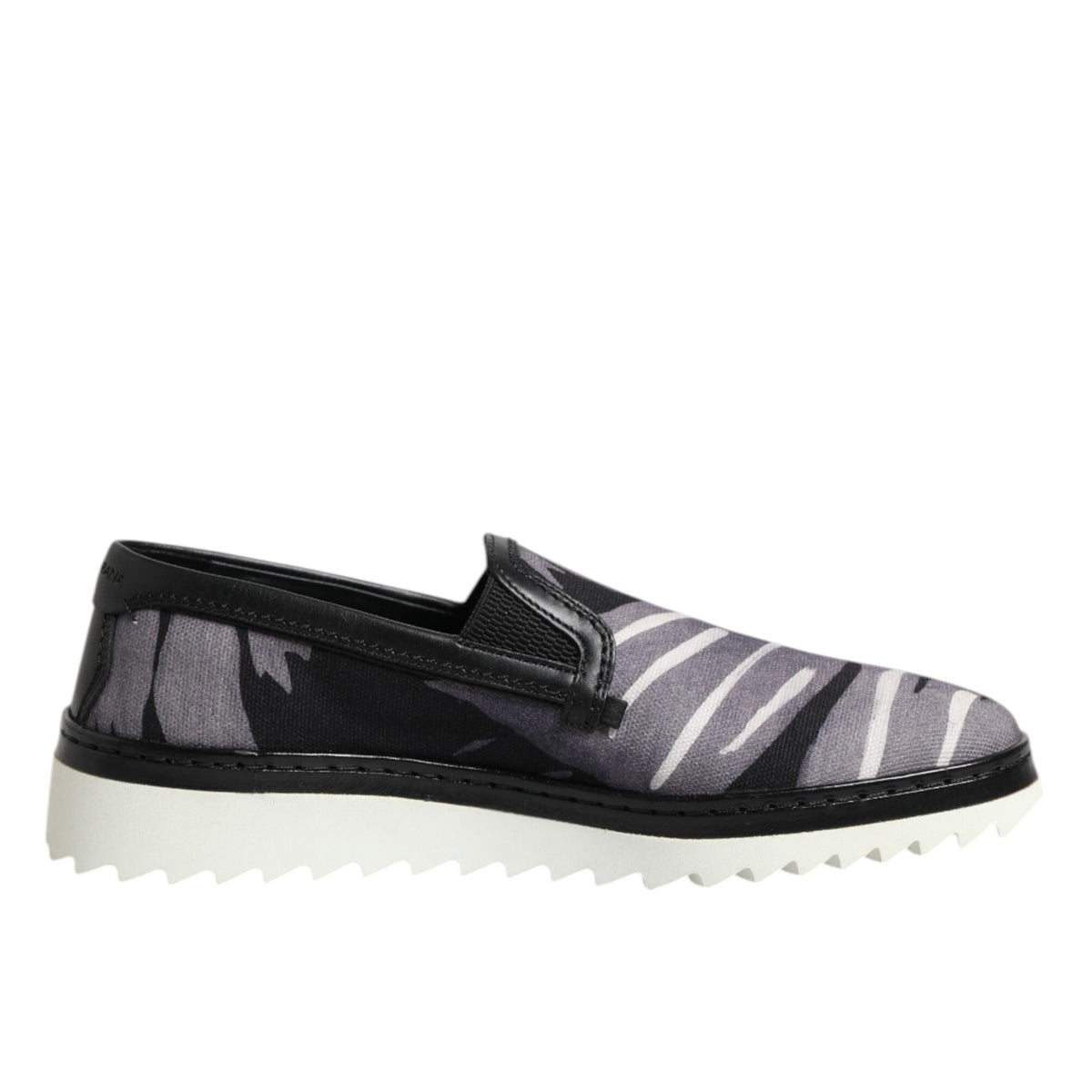 Black and gray slip-on shoe with white sole on a white background