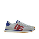 White sneaker with red logo and blue accents on a white background