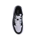 Black and white sneaker with 'AMIRI' branding on a white background