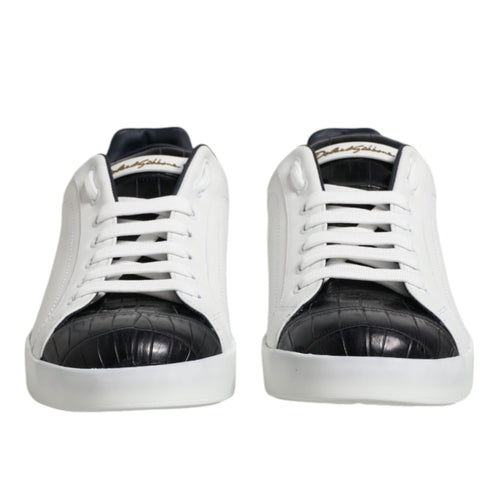 White sneakers with black soles on a white background