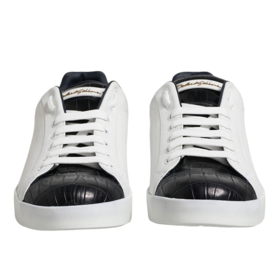 White sneakers with black soles on a white background