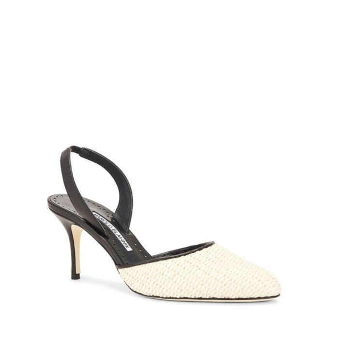 White high-heeled shoe with black slingback on a white background