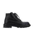 Black leather boot on a white background