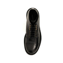 Black leather boot with a white sole on a white background