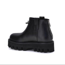 Black platform ankle boot on a white background