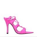 Pink high-heeled sandal with strappy design on a white background