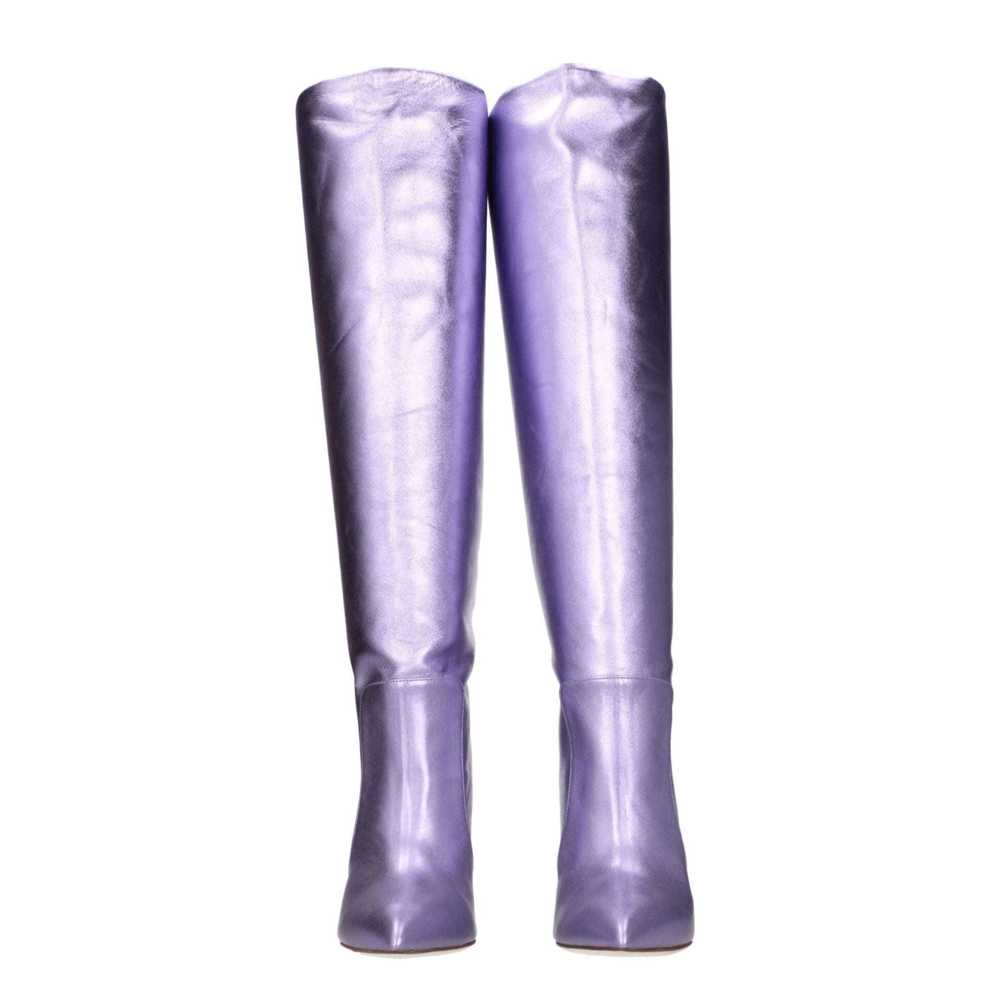 Pair of purple knee-high boots on a white background