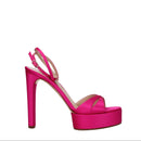 Pink high-heeled sandal on a white background