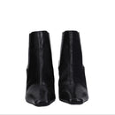 Pair of black ankle boots on a white background