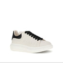 White sneaker with black accents on a white background