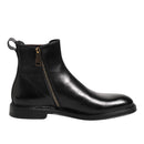 Black leather Chelsea boot with a zipper on a white background