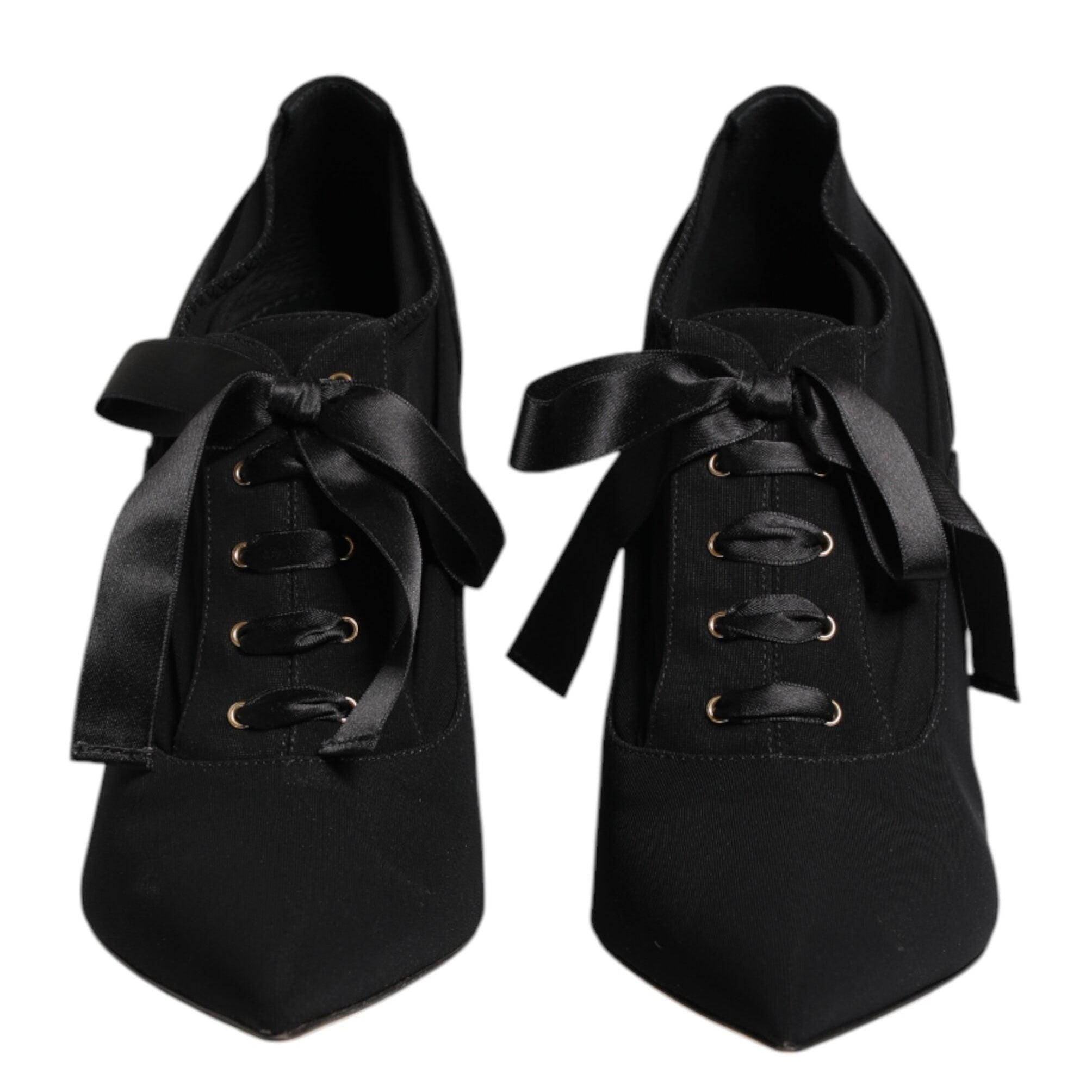 Black shoes with ribbons on a white background