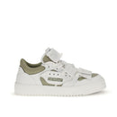 White sneaker with green accents on a white background