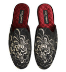Pair of Dolce & Gabbana slippers with floral embroidery on a white background