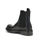 Black Chelsea boot on a white background